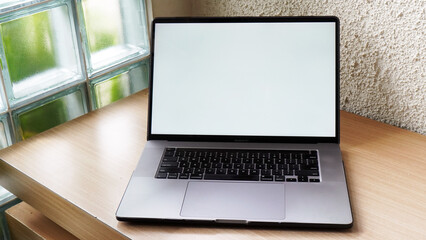 Modern Space Gray MacBook Pro Mockup on Minimalist Wooden Desk with Blank Screen