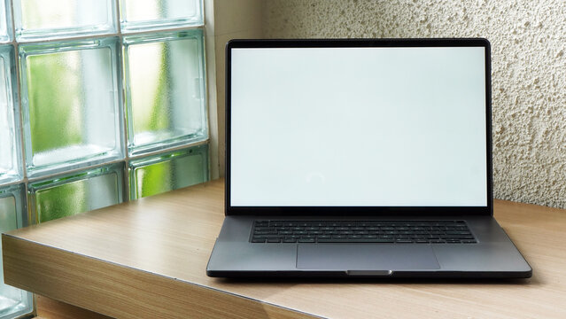 Modern Space Gray MacBook Pro Mockup on Minimalist Wooden Desk with Blank Screen