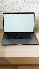 Modern Space Gray MacBook Pro Mockup on Minimalist Wooden Desk with Blank Screen