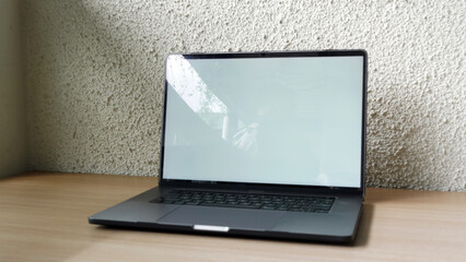 Modern Space Gray MacBook Pro Mockup on Minimalist Wooden Desk with Blank Screen