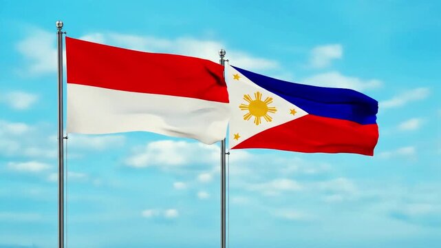 Vibrant flags of Indonesia and the Philippines wave proudly against a beautiful azure sky, symbolizing national pride and diplomatic relations between these two nations.