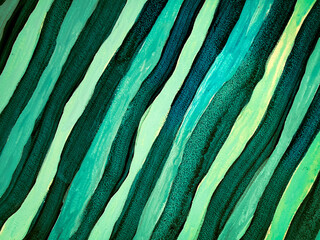 Abstract acrylic painting background with green stripes and artistic brush strokes creative emerald teal waving lines canvas texture