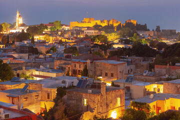 Obraz premium Illuminated Rhodes Old Town with the Palace of the Grand Master rising above the city at night, Greece