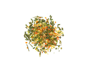 Dried vegetable mix isolated. Dehydrated greens, onion, carrot pieces, seasoning chips, flakes