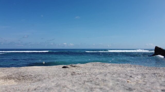 Aerial drone standstill to liftoff of ocean view at Nyang Nyang Beach, Bali Indonesia