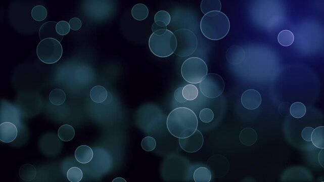 Abstract blue bokeh background with soft floating circles and dynamic movement