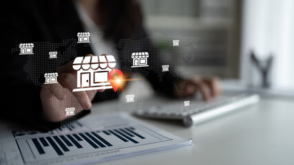 Businesswoman engaging with a digital interface featuring shop icons, symbolizing e-commerce growth...