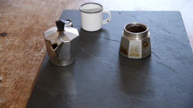 Making coffee with Moka pot. Italian espresso coffee in moka close-up.