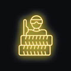 Obraz premium Yellow neon icon of a soldier taking cover behind a stack of tires, holding a weapon