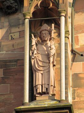 Telephoto close-ups of sculptural details of Freiburger M&uuml;nster cathedral, including Gothic saints, prophets, gargoyles, ornamental figures and waterspouts carved in red , DE, Mart 2011