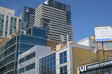 Fototapeta premium buildings and sign of Focused Studios Inc, a physical fitness program, located at 250 Eglinton Av E, Toronto