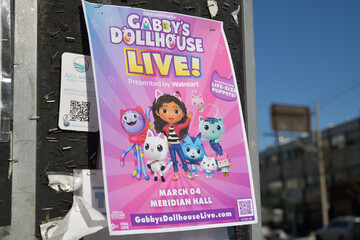 Fototapeta premium colorful Gabby's Dollhouse Live promotional poster in Toronto