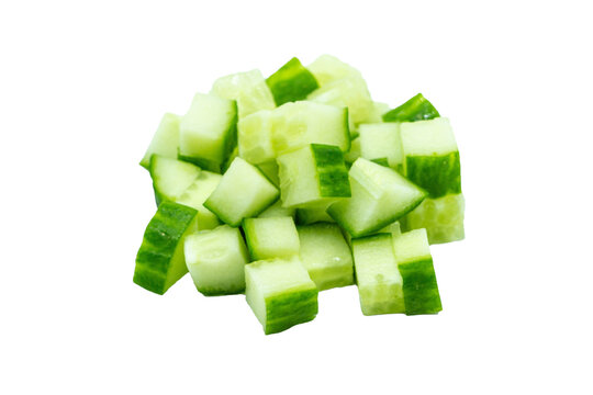pile of fresh diced cucumber cubes isolated on white background
