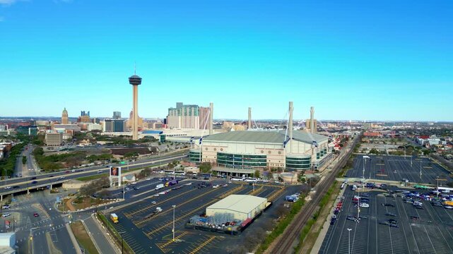 Aerial view of the San Antonio sky line including the Alamodome with the Tower of the Americas and downtown San Antonio visible in the background on a clear winter day.
