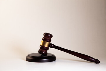 Law theme, mallet of judge, wooden gavel isolated on white background