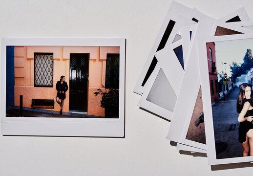 Real photo of Empty Polaroid Frames on Table. PSD mockup Templates