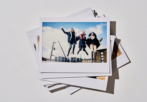 Real photo of Piled Vintage Instant Photos. PSD mockup Templates