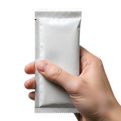 A hand holding a small silver packet