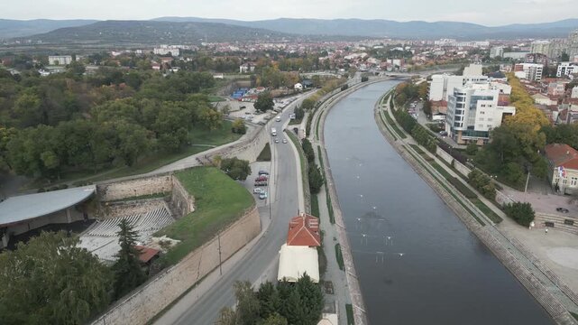 Aerial view of Nisava river in the city of Nis, southern Serbia. Drone capture, flying backwards.