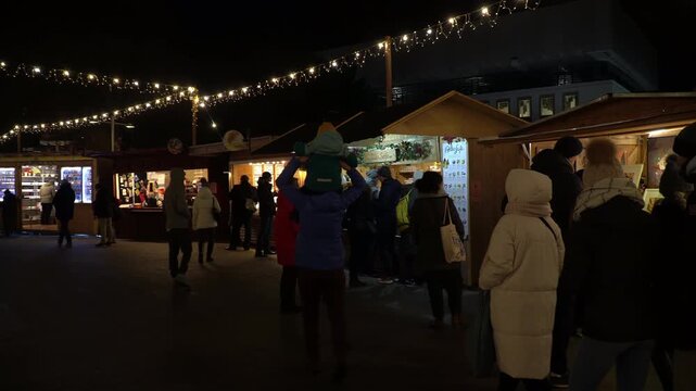 Traditional Christmas market in central Vienna, Austria. Night video.