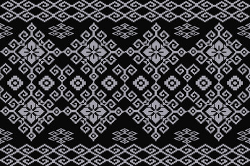 Fototapeta premium This is a digital drawing canvas displaying a black background and silver geometric pattern composed of repeating diamond and floral motifs arranged I a symmetrical.