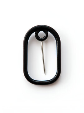 Black cotter pin with a white background