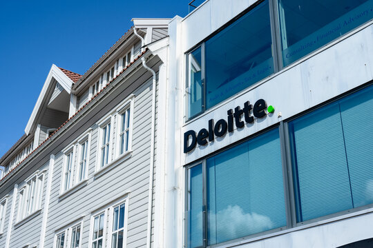 Grimstad, Norway - August 27 2023: deloitte office building with modern glass windows.