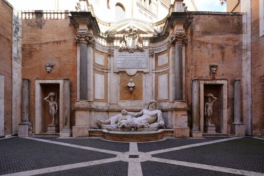 Marforio is a large 1st century Roman marble sculpture of a reclining bearded river god or Oceanus
