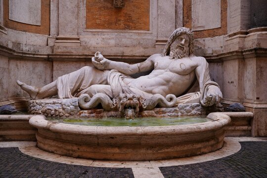 Marforio is a large 1st century Roman marble sculpture of a reclining bearded river god or Oceanus
