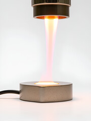 Detailed Close Up View of Electrorefining Process in Precious Metal Production Showing Bright Flames Refining Metal on Metallic Surface at Eye Level with Bright Lighting and Plain White Background