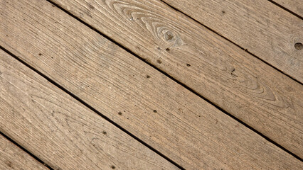 Obraz premium Diagonal View of Weathered Natural Wood Planks with Visible Grain and Knots ฺฺBackground Texture
