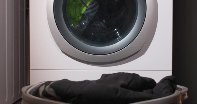 Laundry Prep Process. Methodically Checking Pockets And Fabric Placement Before Washing Process Begins