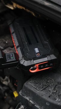 Starting The Engine With A Portable Jump Starter Battery Device In Winter