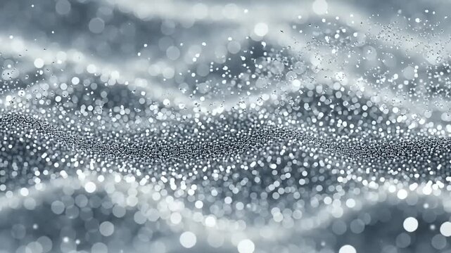 Abstract shimmering silver waves of glittering particles creating a magical, elegant background with a bokeh effect, perfect for luxurious and celebratory designs