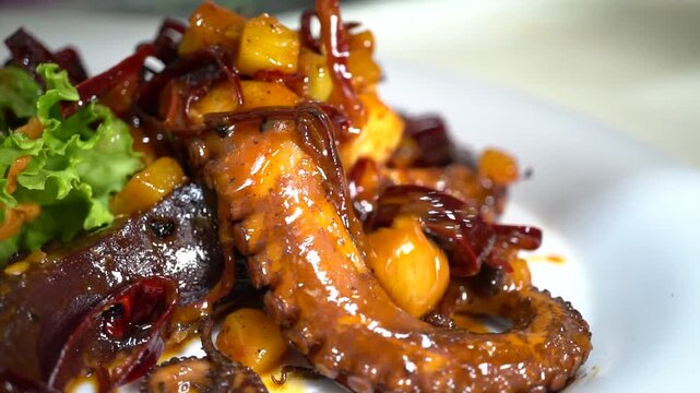 Pulpos al ajillo con chile guajillo Close up