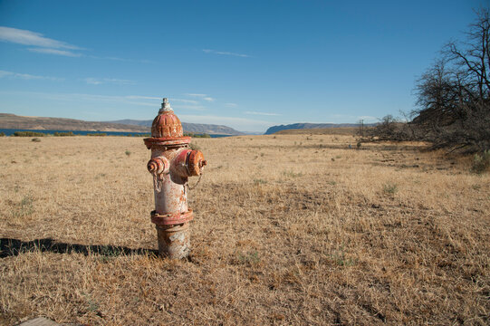 USA, Washington, Ellensburg.  Fire hydrant in the middle of dry rangeland.