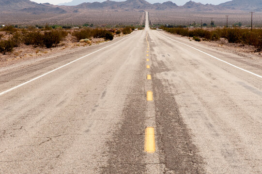 USA, California, Chambless.  Straight road through the Mojave Desert.  Route 66