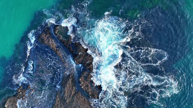 Ocean surf waves. Clear turquoise waves. Summer beach waves. Strong wave movement. Waves along dramatic coastline.