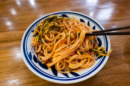 Liang Pi, Tor cold noodles, a traditional chinese cold skin noodles dish. Famous dish in Xian, Shaanxi province, China