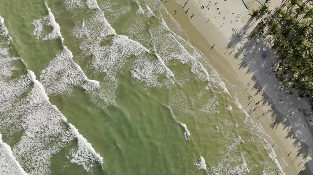 My Khe Beach, Da Nang, Vietnam &ndash; 4K aerial drone footage of tropical coastline, sandy beach, palm-lined coastline, ocean waves, and modern city skyline, costal roads