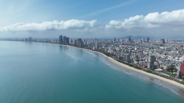 Da Nang, Vietnam &ndash; 4K aerial drone footage of Son Tra Beach, curved coastline, coastal city skyline in the morning