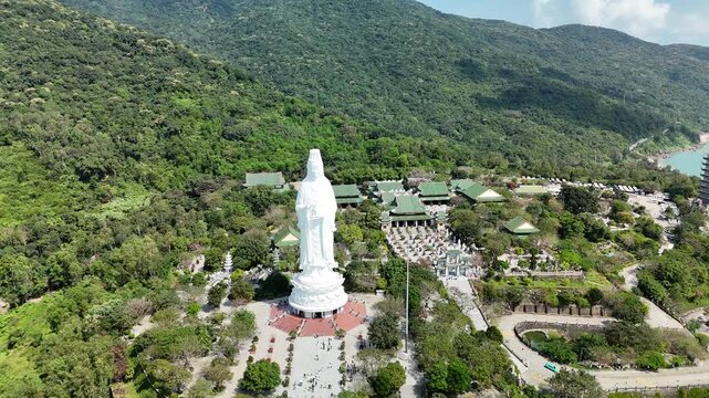 Linh Ung Pagoda, Son Tra Peninsula, Da Nang, Vietnam &ndash; 4K aerial drone footage of Buddhist temple, Lady Buddha statue, coastal mountains and tropical bay