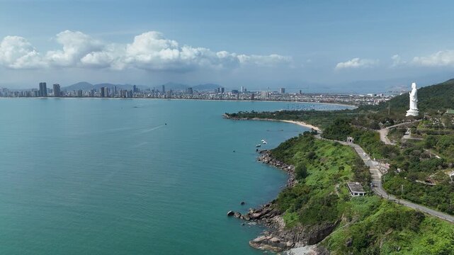 Son Tra Peninsula, Da Nang, Vietnam &ndash; 4K aerial drone footage of coastal mountains, tropical bay, remote beach, forest, city skyline in distance