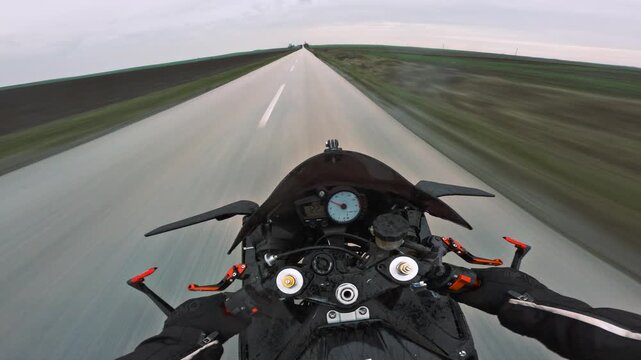 POV sportbike cruising on a straight countryside highway