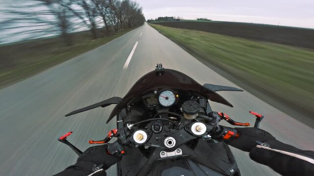 POV sport motorcycle ride on an empty rural road