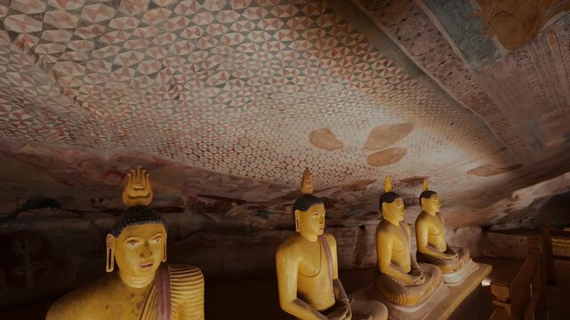 Dambulla Cave Temple with ancient murals, frescoe wall paintings and Buddhist sculptures. Sri Lanka
