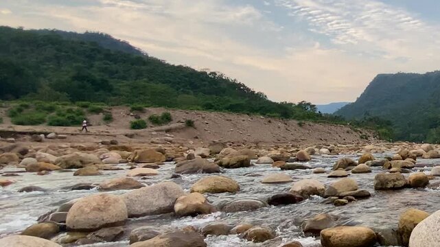 River in a rocky forested valley in the Sylhet region of Bangladesh South Asia