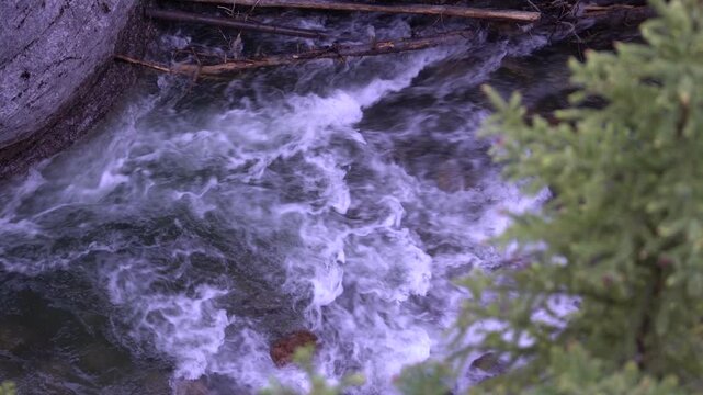 Water rushing through the deep and narrow river gorge of Maligne Canyon in Jasper National Park, Canada.