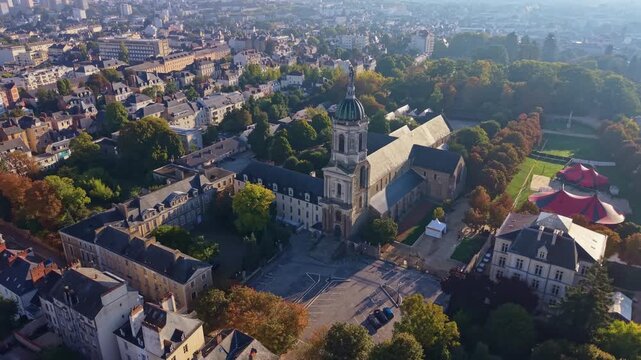 Notre Dame en Saint Melaine church and its abbey, surrounded by the Thabor park in Rennes, France. Aerial drone