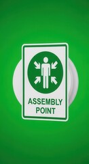 Clear Emergency Assembly Point Signage Displayed Against A Vibrant Green Backdrop
